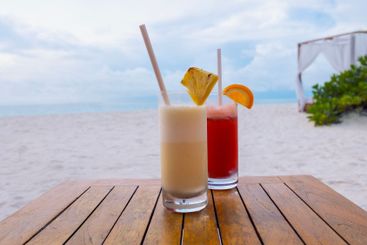 Two delicious chilled cocktails on a wooden table...