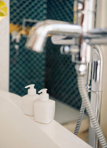 Close-up mockups of cosmetic jars with dispensers on the...