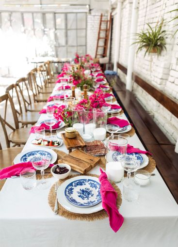 A set festive table in the open air. The table is...