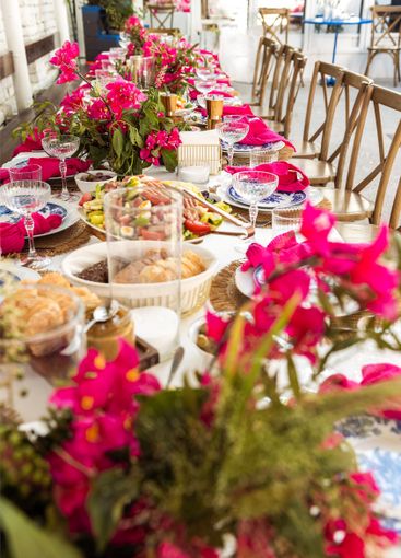 A set festive table in the open air. The table is...