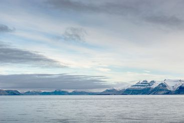 Snowy mountains and sea in Svalbard, Norway