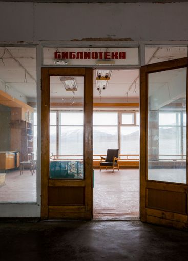 Open door to chair by window