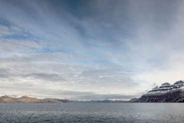Snowy mountains and sea in Svalbard, Norway