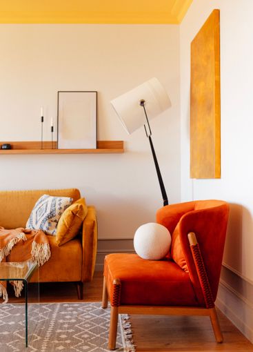 Close-up of a soft orange armchair made of natural...