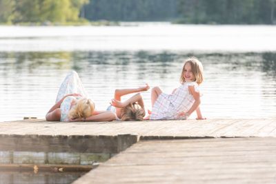 Family relaxing on a boat dock