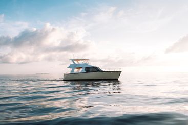 A modern luxury yacht on the high seas. A white boat in...