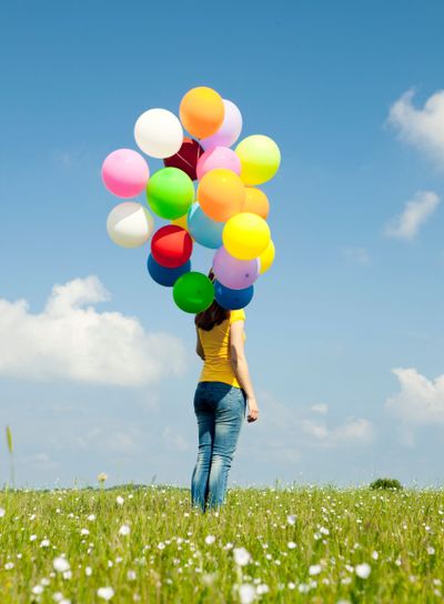 Girl with colorful balloons