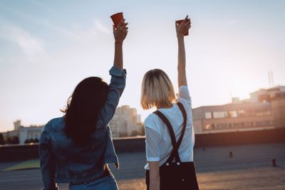 women relaxing on roooftop