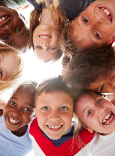 Group Of Multi-Cultural Children With Friends Looking...