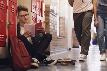 Learning has no limits. a teenage boy reading a book...