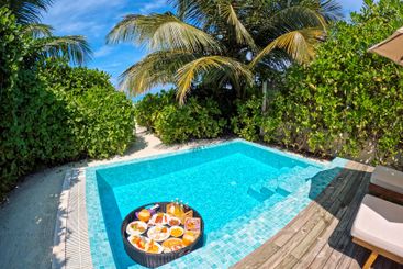 A floating breakfast tray with various dishes and drinks...