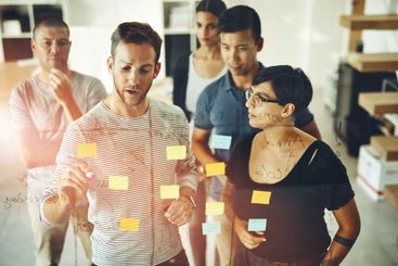 Manager, leader or boss talking and planning in a...