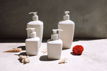 A collection of white mock-ups of jars with dispensers...