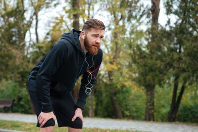 Tired runner in park