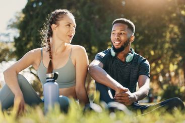 Relax, man and woman on grass, for wellness and exercise...