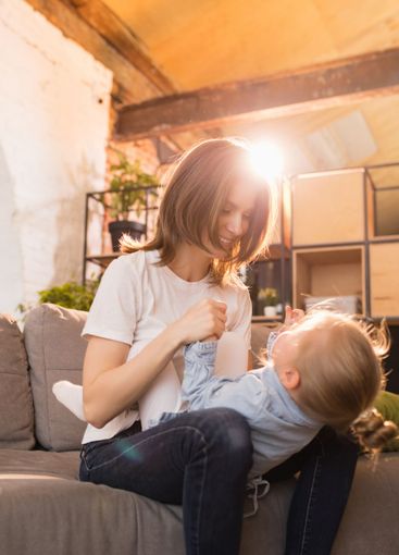 Family time. Mother and daughter having time together at...